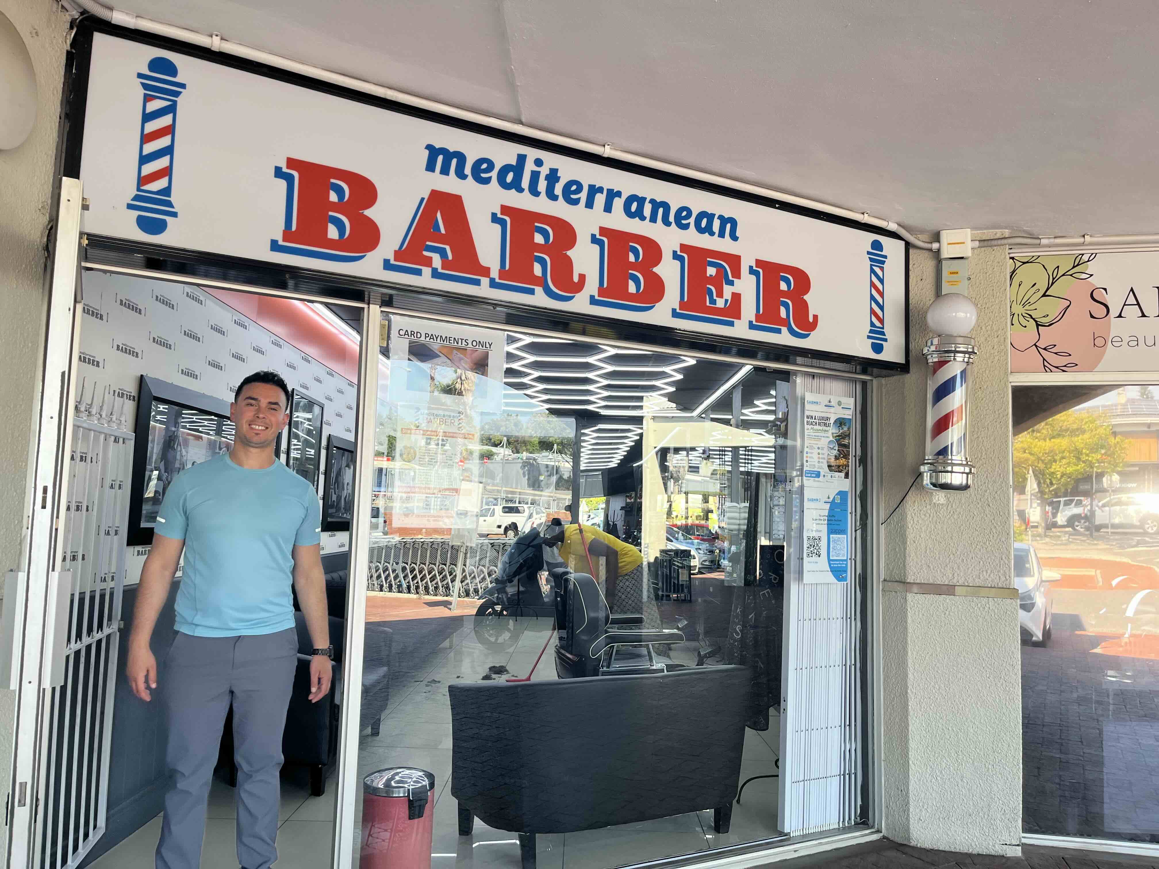 The owner outside Mediterranean Barber at Welgemoed Plaza